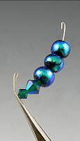 Blue beads on wire